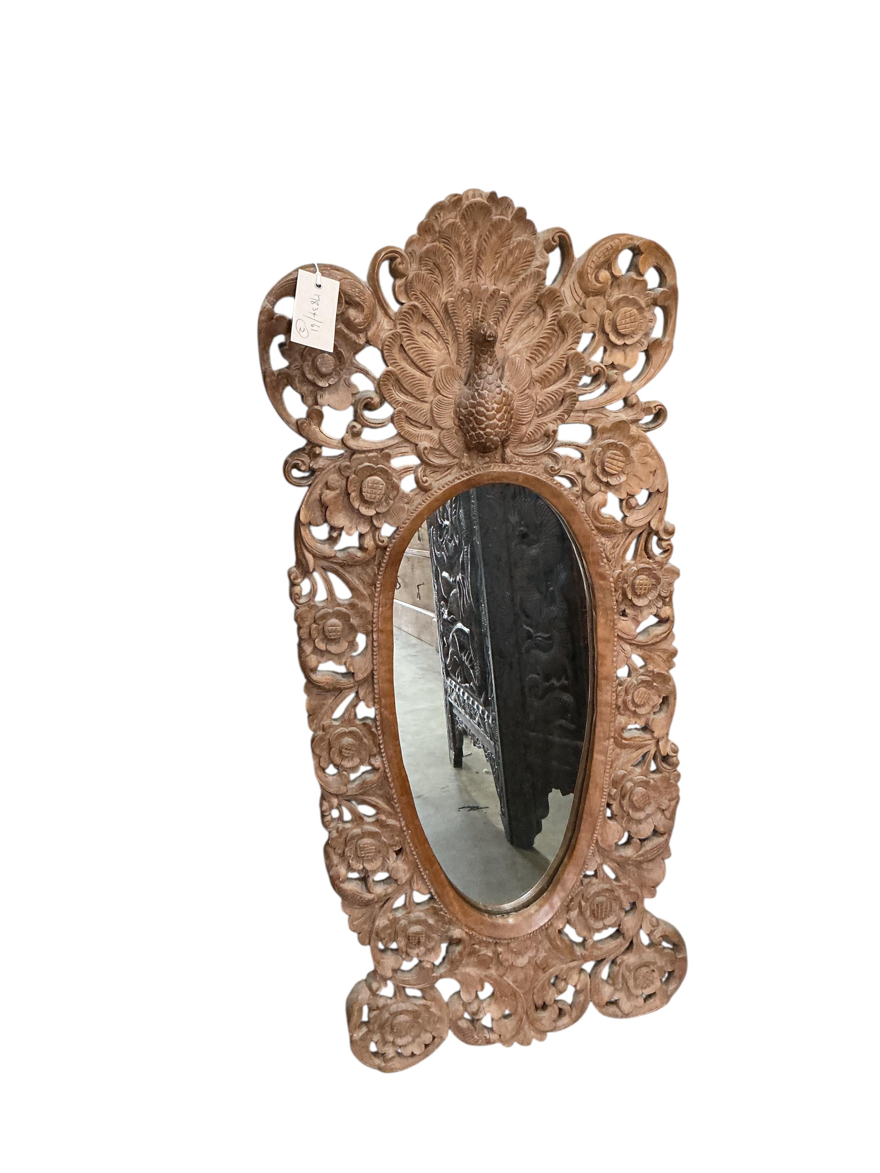 A Far Eastern carved hardwood triple panel firescreen and a wall mirror, mirror height 90cm